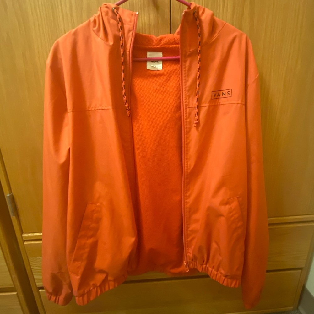 Vans orange colored windbreaker (zip-up) with a drawstring hoodie & pockets